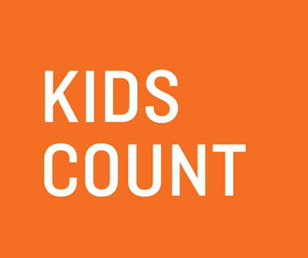 White text reading KIDS COUNT on a solid orange background.