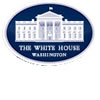 The image shows the official logo of The White House in Washington, featuring a white illustration of the White House building on a dark blue oval background with the words “The White House Washington” below.